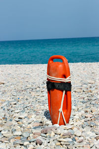 View of sunglasses on beach against sea