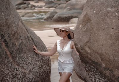 Woman standing on rock