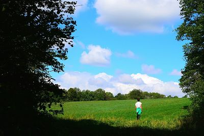 People walking on grassy field