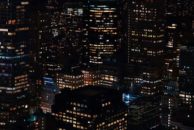 Illuminated buildings in city at night