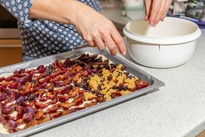 Midsection of woman preparing food