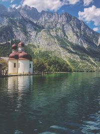 Scenic view of lake and mountains against sky