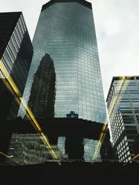 Low angle view of office building against sky