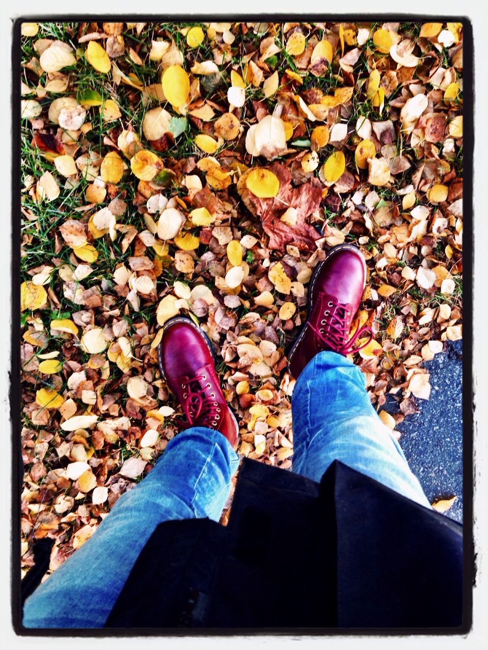 low section, person, lifestyles, transfer print, shoe, leisure activity, men, auto post production filter, standing, personal perspective, jeans, footwear, high angle view, human foot, stone - object, casual clothing, day