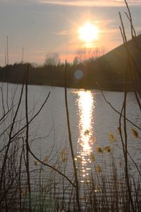 Scenic view of lake against sky during sunset