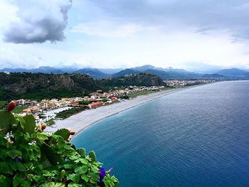 Scenic view of sea against cloudy sky