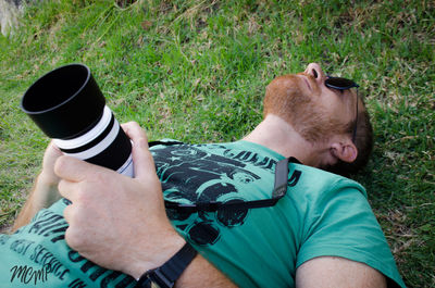 Low section of man sitting on grass