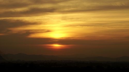 Scenic view of dramatic sky during sunset