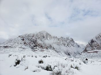 Snow covered mountain against sky