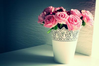 Close-up of pink rose in vase