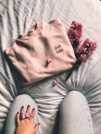 High angle view of person relaxing on bed at home