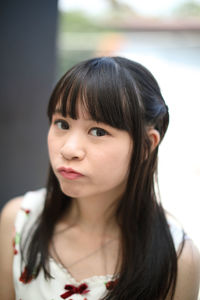 Close-up portrait of woman at cafe