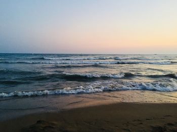 Scenic view of sea against clear sky during sunset