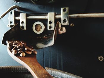 Close-up of machine part and roastng of coffee bean
