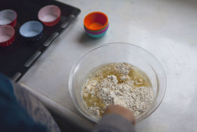 High angle view of person preparing food on table