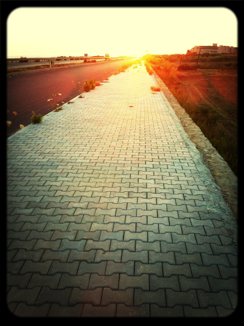 the way forward, transfer print, diminishing perspective, vanishing point, auto post production filter, sunlight, transportation, surface level, road, sun, sky, empty, asphalt, road marking, long, cobblestone, outdoors, street, sunset, sunbeam