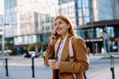 Young woman standing in city