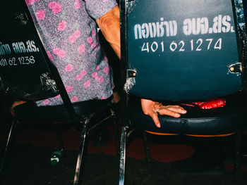 Close-up of text on chair at home