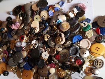 High angle view of various buttons on table