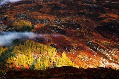 Aerial view of landscape against sky during autumn