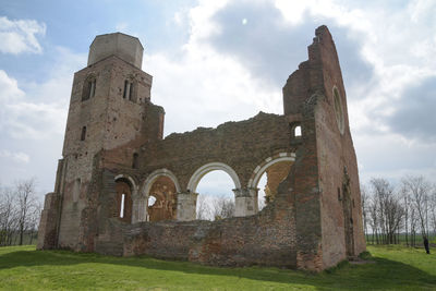 Old ruin building against cloudy sky