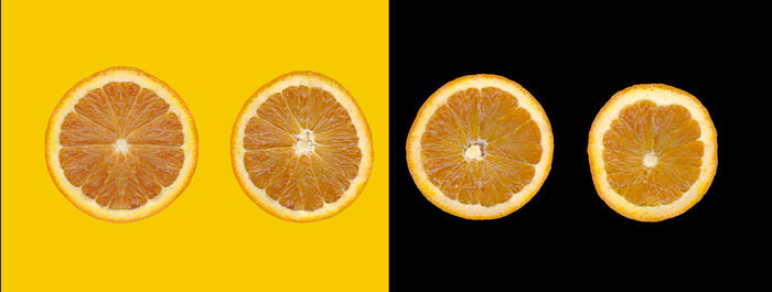 Digital composite image of orange fruit against yellow background