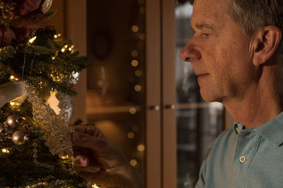 Portrait of man with christmas tree