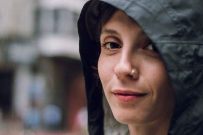 Close-up portrait of woman wearing hood