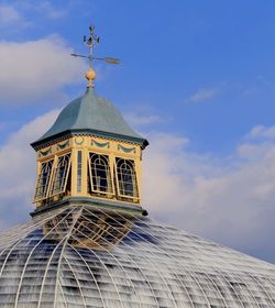 High section of historic building against sky