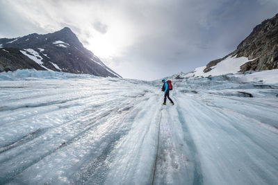 People skiing on snow covered mountain