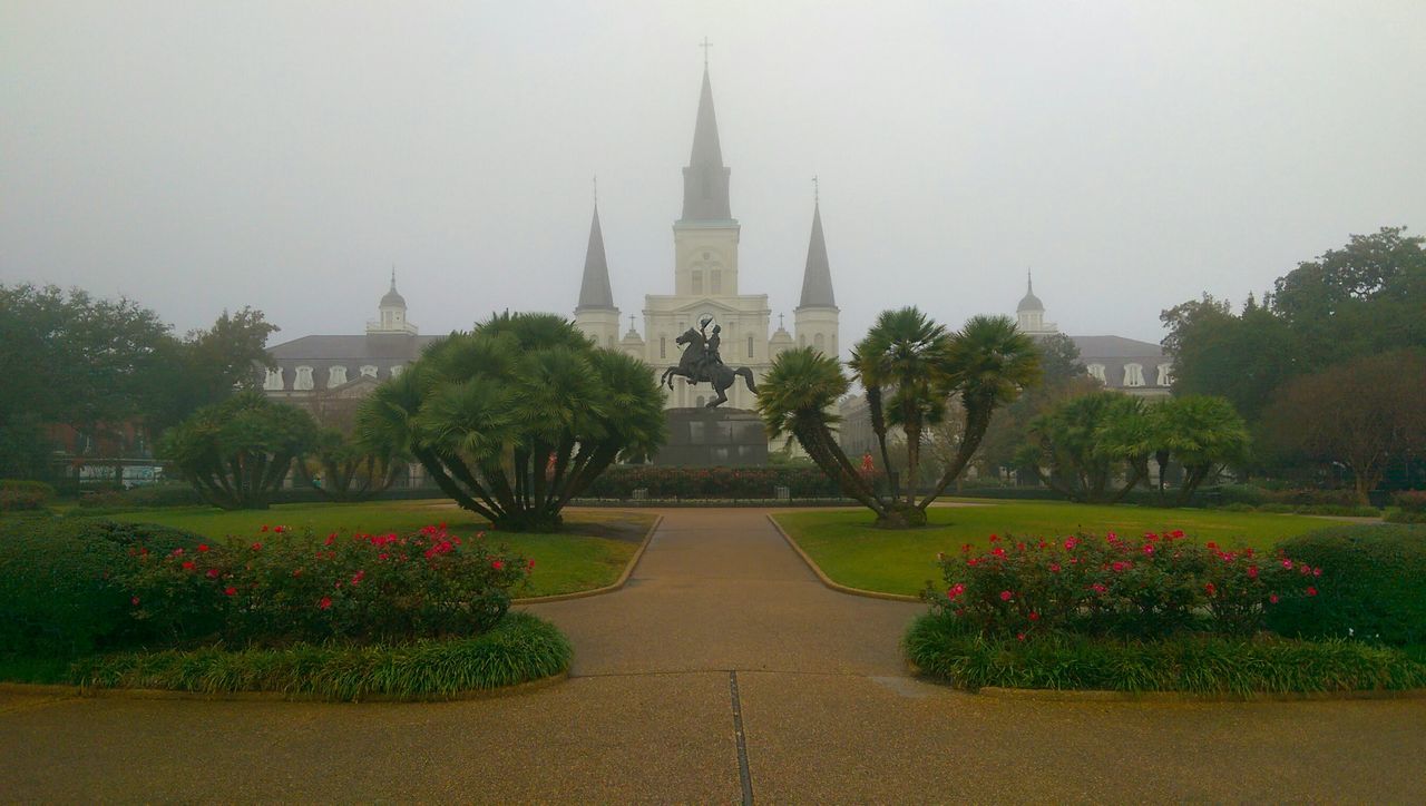 architecture, building exterior, built structure, tree, religion, place of worship, spirituality, famous place, church, clear sky, travel destinations, dome, city, flower, growth, tourism, formal garden, travel