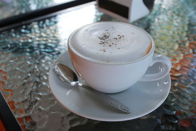 High angle view of coffee cup on table