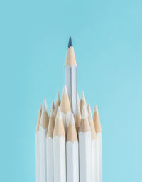 Close-up of colored pencils against white background