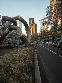 Street amidst buildings against sky