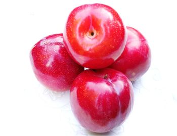 Close-up of apple against white background