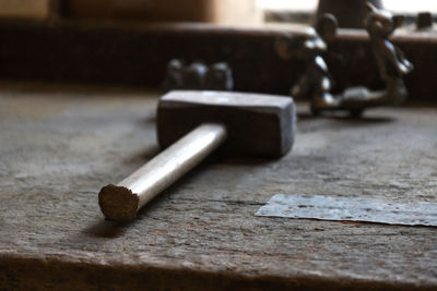 Close-up of hammer on table