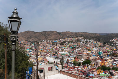 High angle view of buildings against sky in city