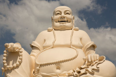 Low angle view of statue against sky