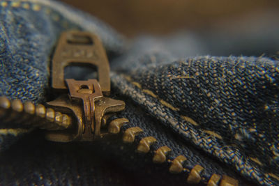 Close-up of metallic zip on jeans