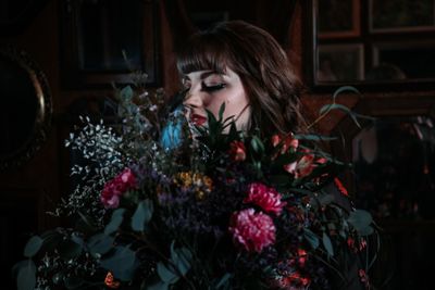 Portrait of woman with red flowers