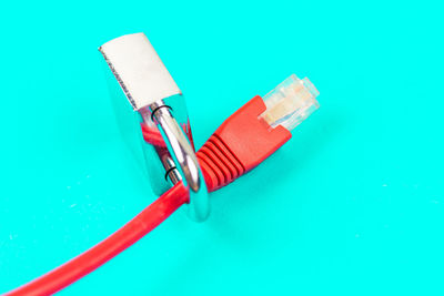 High angle view of paintbrushes on blue background