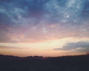 Scenic view of landscape against cloudy sky