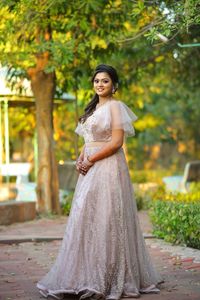 Portrait of a smiling young woman standing outdoors