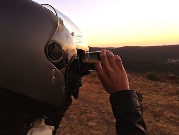 Close-up of person photographing camera