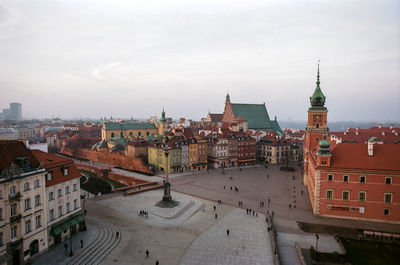 High angle view of buildings in town against sky
