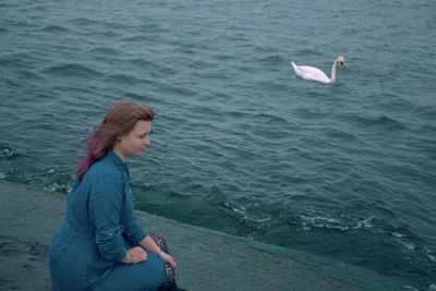 Woman sitting in sea