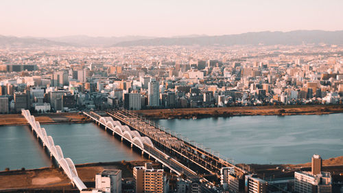 High angle view of river amidst buildings in city