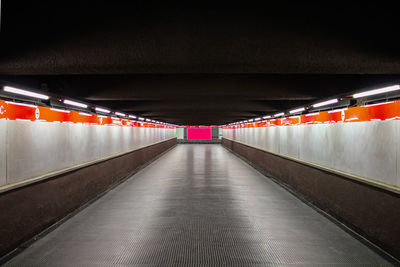 Empty illuminated subway tunnel