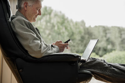 Man sitting on mobile phone