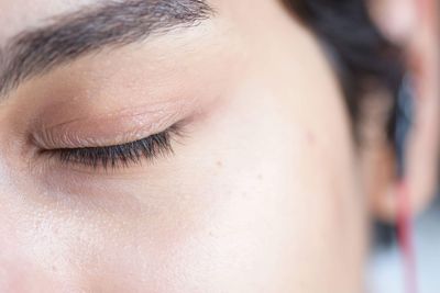 Close-up of woman with eyes closed